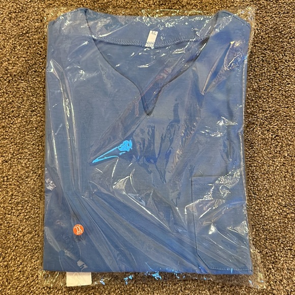 Unisex Grey, Purple, Blue, and White XL short sleeve shirts in package $15 Total - Picture 4 of 5